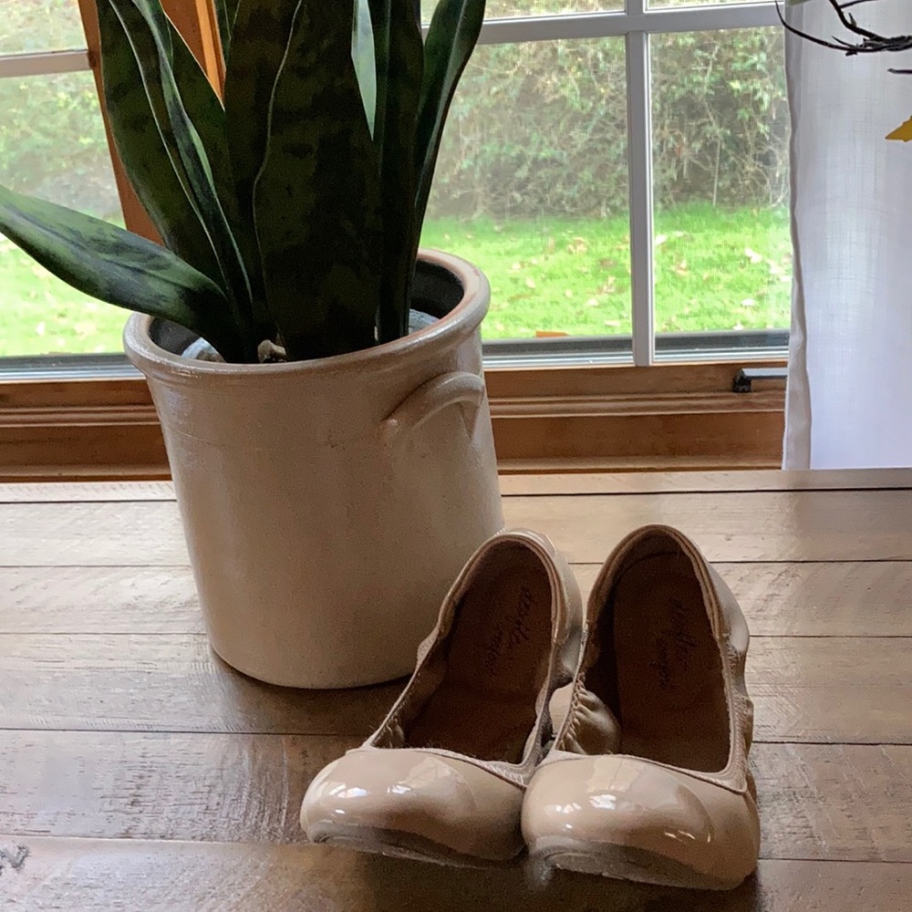 Shoes. These very light skin tone shoes bend to fit in your purse .